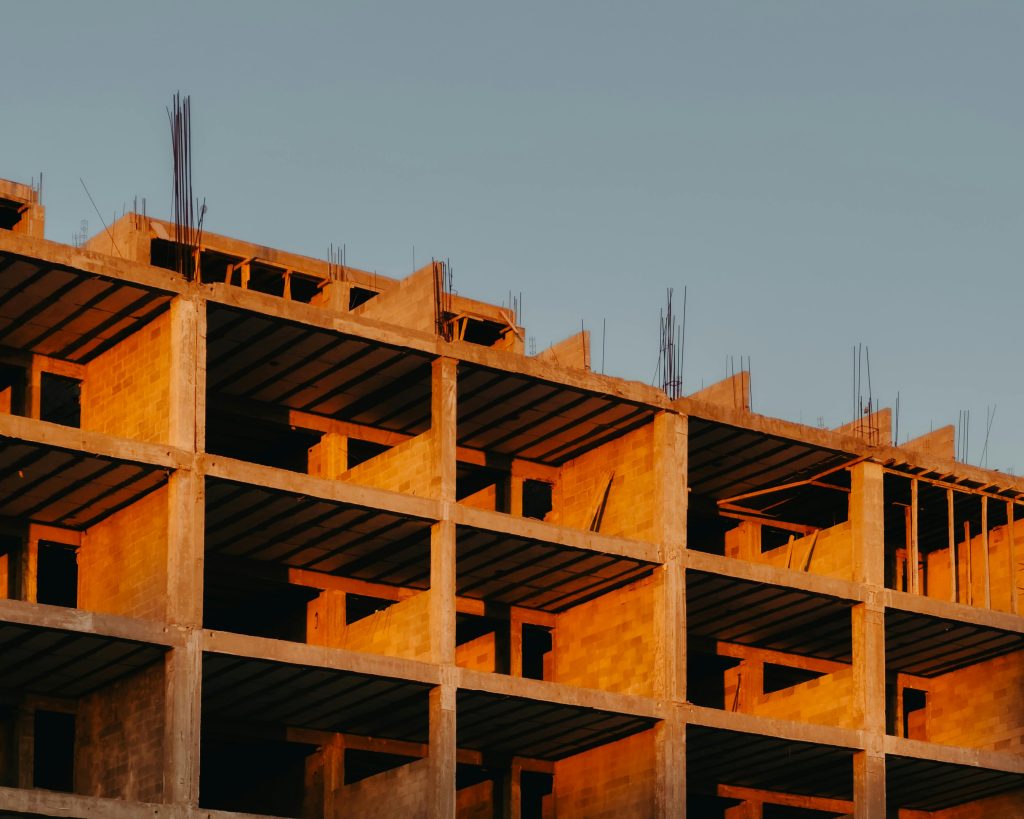 image of a building under construction with a blue sky in the background.