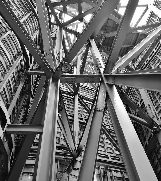 Close-up of a steel structure showing its geometric shapes and beams.